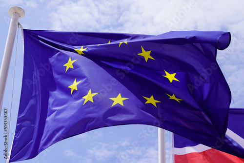 european union flag waving in sky