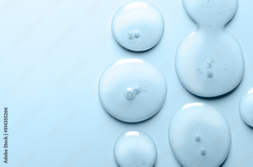 Blue drops of gel close-up. Cosmetic product for moisturizing the skin of the face or body. Copy space Blue drops of gel close-up. Cosmetic product for moisturizing the skin of the face or body. Copy space