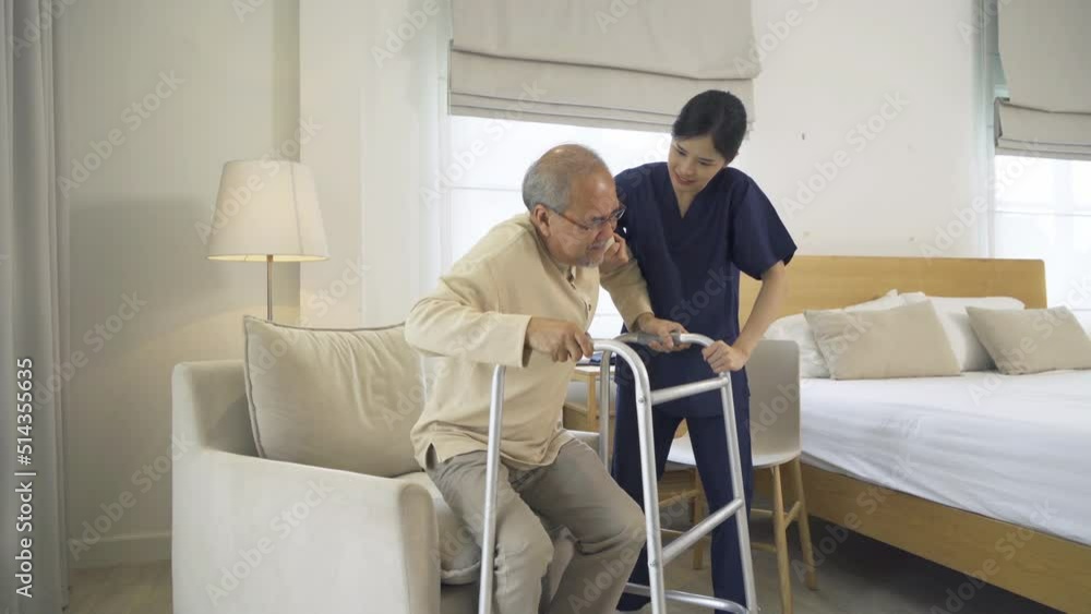 Asian woman nurse, daughter help father to get up from chair, supporting old senior elderly patient in bedroom in home or house in medical and healthcare. People lifestyle. Family disability therapy. Asian woman nurse, daughter help father to get up from chair, supporting old senior elderly patient in bedroom in home or house in medical and healthcare. People lifestyle. Family disability therapy.