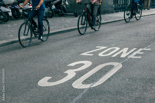 Canvastavla speed limit sign on street, bicycles on road at area of zone 30 speed limit
