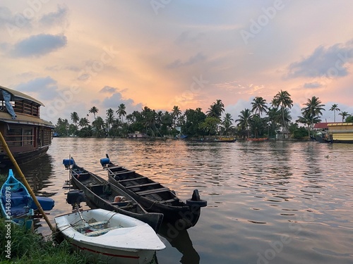 Bild auf Leinwand boats in Kerala backwaters sunset