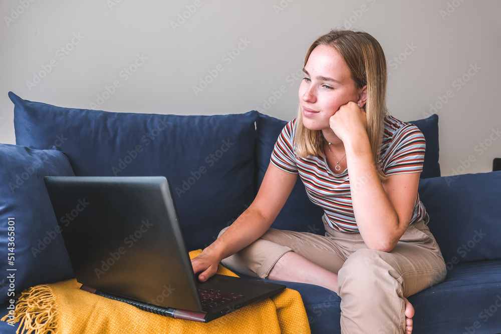 Fototapeta premium Remote work.Girl freelancer works remotely on the seashore.workation, remote work,WFVH,Van Life vibes work from vacation home,work travel,remotely work.Travelling