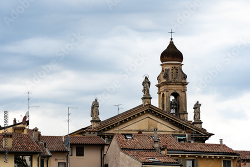 View of Verona roofs with a church and statues
