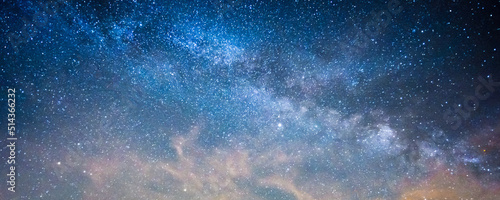 Milky way panorama banner background with blue and purple colors 