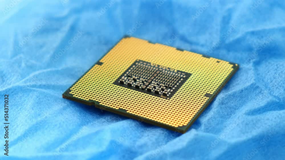 CPU in hands of a technician. The processor is being examined for apparent defects. In Modern Electronic Manufacturing Factory Design Engineer Holds Microchip . Close-up a New Generation Microchip. CPU in hands of a technician. The processor is being examined for apparent defects. In Modern Electronic Manufacturing Factory Design Engineer Holds Microchip . Close-up a New Generation Microchip.