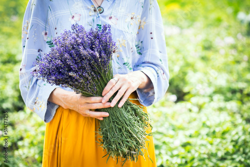 girl holding a bouquet of lavender