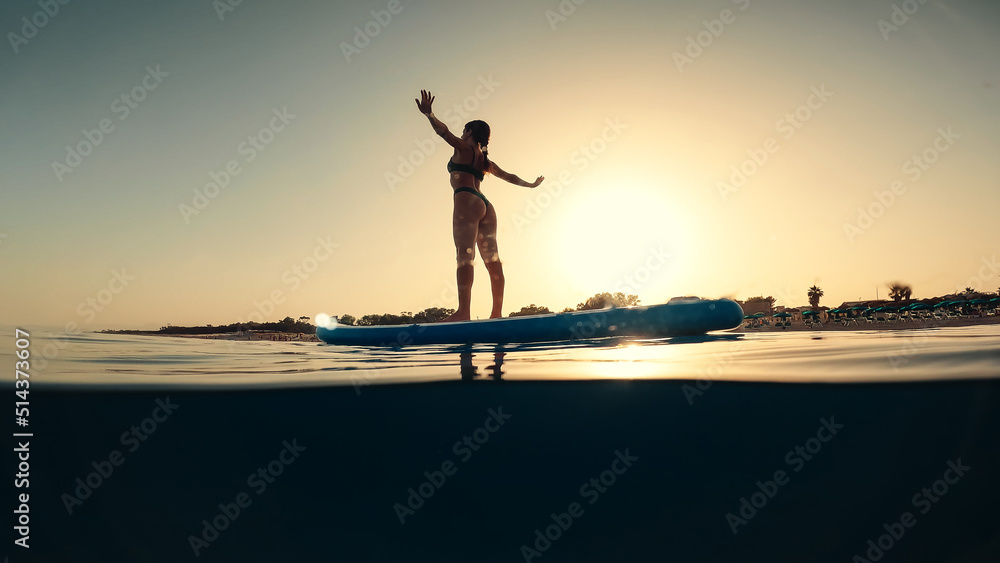 Body stretching on a surf board