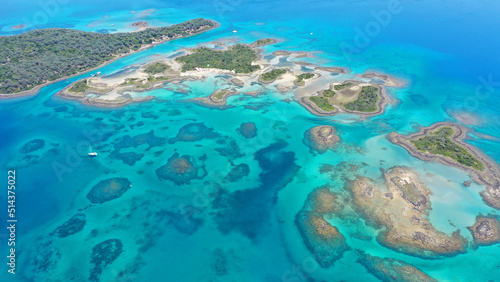 Aerial drone photo of paradise volcanic island complex resembling a blue lagoon archipelago in exotic destination bay with deep turquoise sea and crystal clear water beach