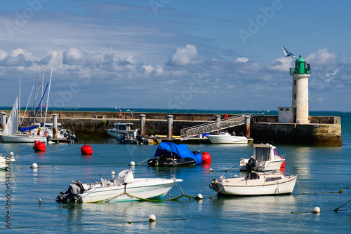 View on the Phare de la Flotte and some boats on the sea from the beach plage de l' Arnérault on a sunny summerday