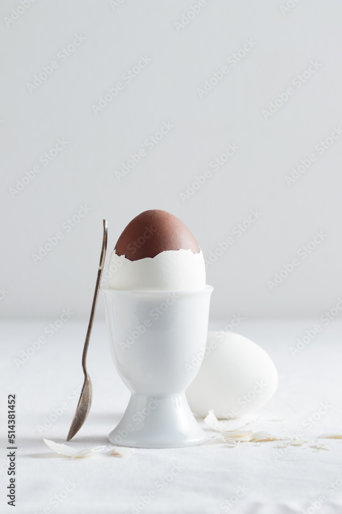 Chocolate egg on white eggstand holder Chocolate egg on white eggstand holder