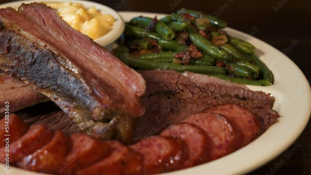 Texas barbecue plate, ribs sausage brisket with green beans and macaroni and cheese, close up slider 4K Texas barbecue plate, ribs sausage brisket with green beans and macaroni and cheese, close up slider 4K