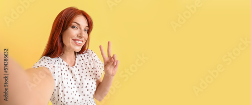 Beautiful redhead woman tak...