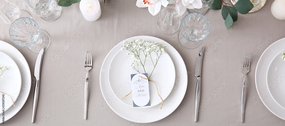 Beautiful wedding table setting with floral decor, top view Beautiful wedding table setting with floral decor, top view