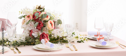 Beautiful wedding table setting with floral decor