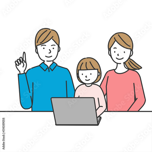 パソコンを使う女の子と見守る両親