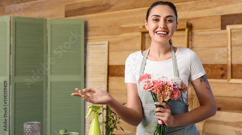 Female florist with beautif...