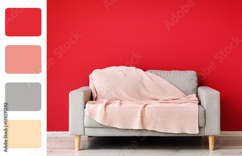 Grey sofa with plaid near r...