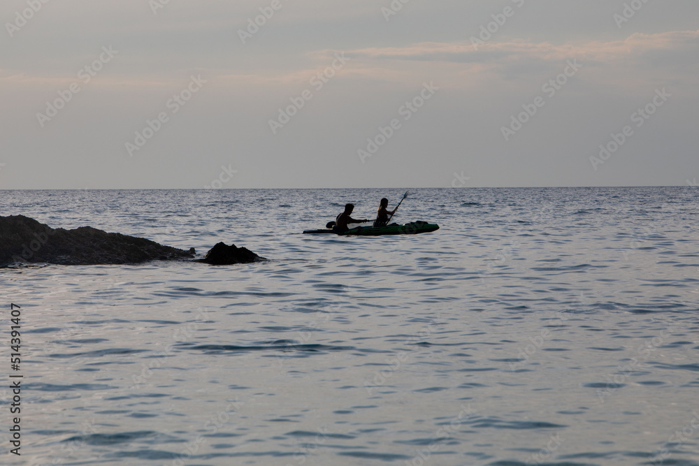kayaker silhouette in the sea