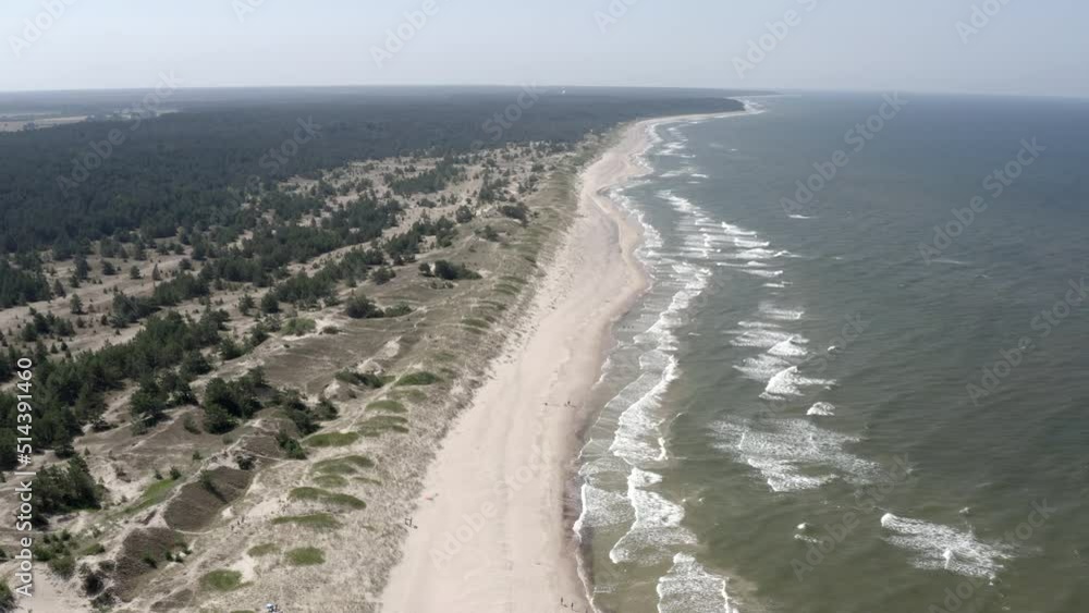 Slow reverse flight above empty beach. Pure nature. no infrastructure. Slow reverse flight above empty beach. Pure nature. no infrastructure.