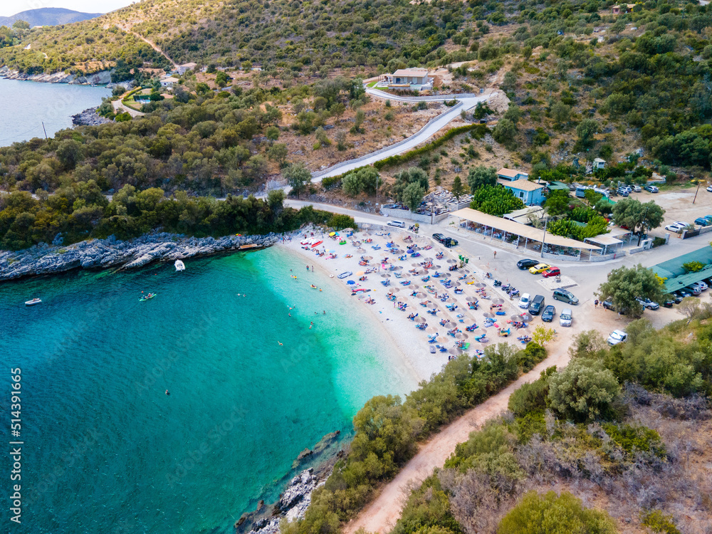 Lefkada island beach overhead view people on sun loungers