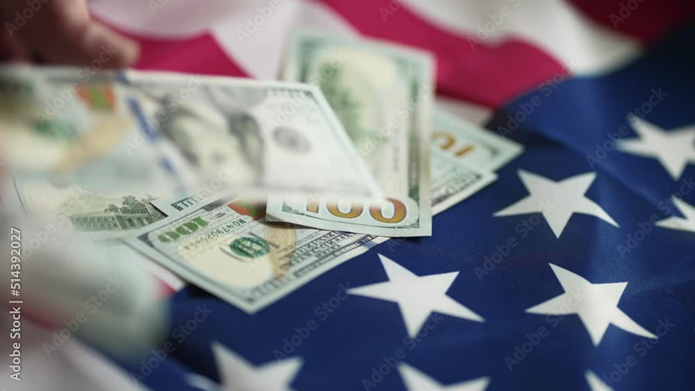 dollar money and American flag. bankrupt man counting money cash. business crisis finance dollar concept. close-up of a usd hand counting paper dollars. exchange finance economy dollar pay tax dollar money and American flag. bankrupt man counting money cash. business crisis finance dollar concept. close-up of a usd hand counting paper dollars. exchange finance economy dollar pay tax