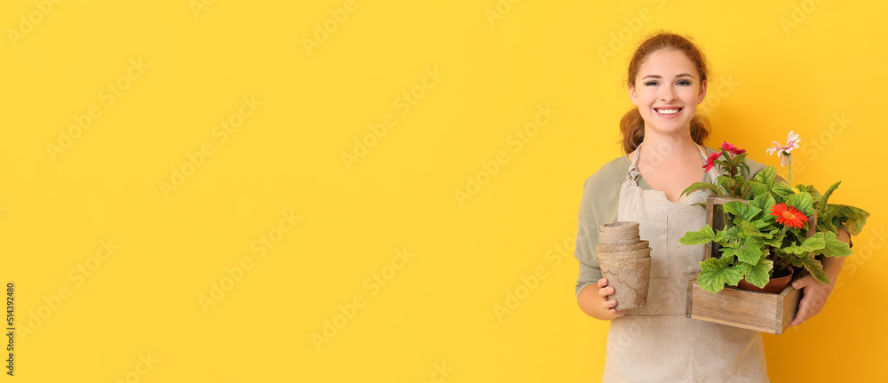Portrait of female gardener on yellow background with space for text Portrait of female gardener on yellow background with space for text
