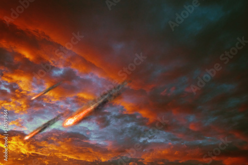 Fiery evening sunset, orange-blue color. Cumulus clouds from which meteorites fly. Meteor Shower of Fire