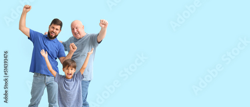 Obraz na plátně Happy man, his little son and father on light blue background with space for tex