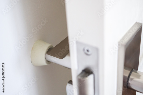 Wallpaper Mural Wall mounted door stopper with modern door handle Torontodigital.ca