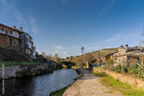 Rural community village in Rio de Onor, Portugal.River and stone houses. photo