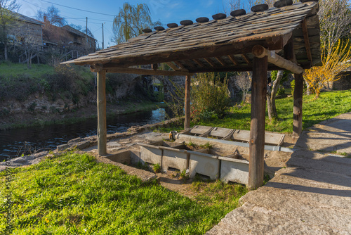 Old washing tank in small rural community village. River of Onor. Portugal. photo