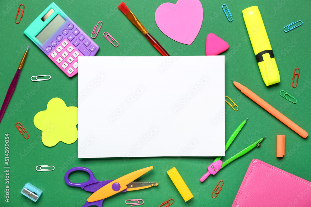 Blank paper sheet with school stationery on green background Blank paper sheet with school stationery on green background
