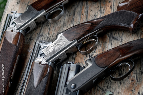 Detail Of Open Hunting Rifles Laying On Table photo