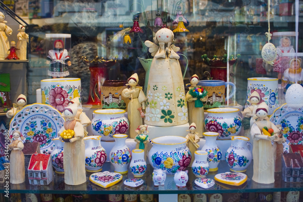 Ceramic souvenirs and dolls on the showcase in Bratislava