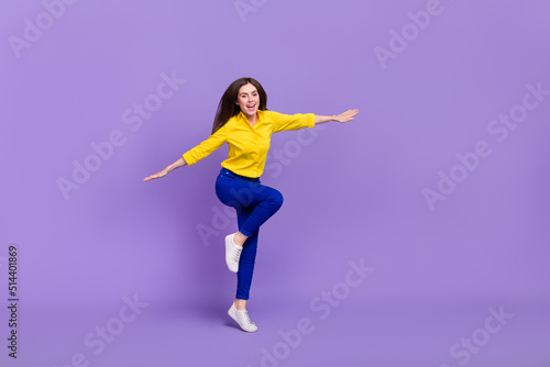 Full length body size view of attractive cheery girl jumping having fun good mood isolated over bright violet purple color background