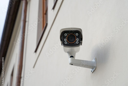 Canvas Print Modern smart outdoor cctv camera with night vision on house, protecting property