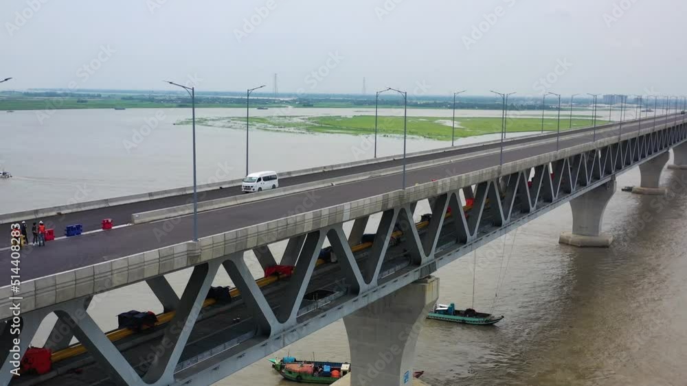 Aerial view of Padma bridge, over the Padma river by day in perspective, Shibchar, Dhaka, Bangladesh. Aerial view of Padma bridge, over the Padma river by day in perspective, Shibchar, Dhaka, Bangladesh.