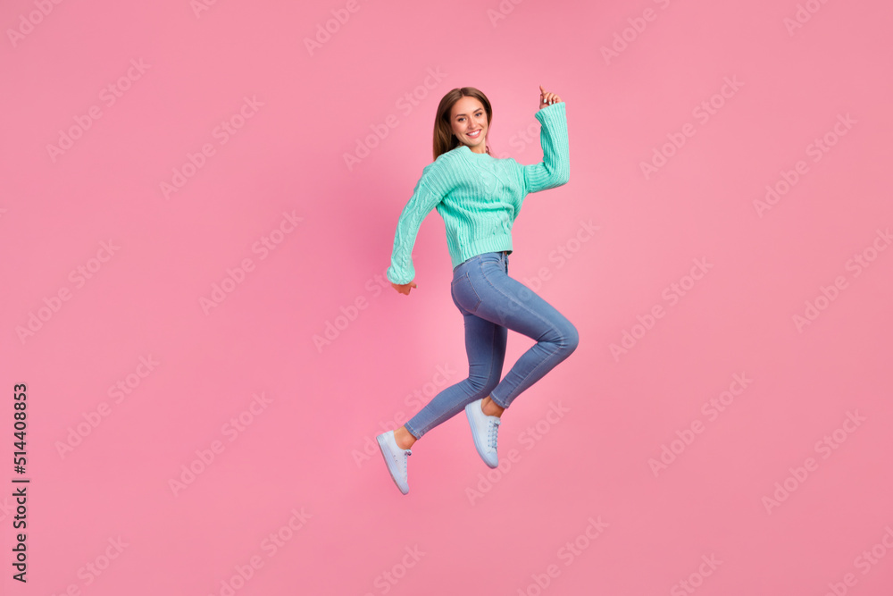 Full body photo of overjoyed sportive person rush hurry jump have good mood isolated on pink color background
