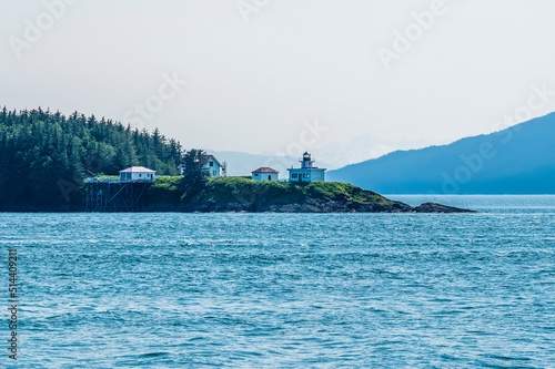 A view towards a lighthouse on a cape in Auke Bay on the outskirts of Juneau, Alaska in summertime