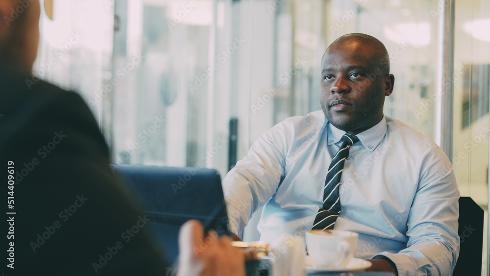 custom made wallpaper toronto digitalAfrican American businessman in formal wear explaining his startup plan to partner in glassy cafe during lunch time