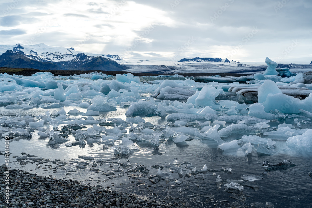iceberg and floating blocks of ice in glacier lagoon iceberg and floating blocks of ice in glacier lagoon