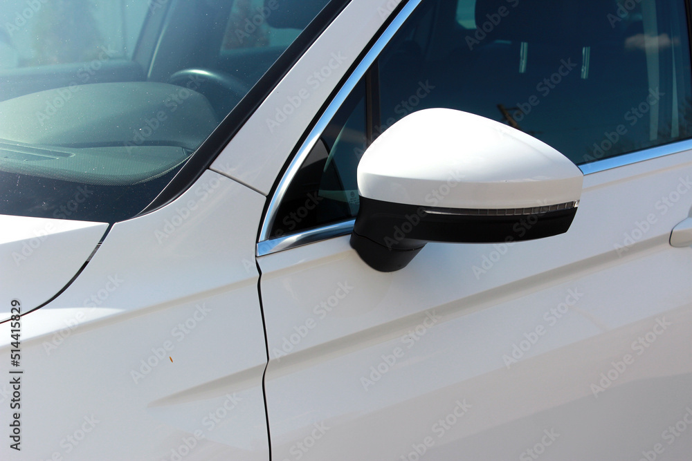White side mirror car. Back view. Rear-view mirror moder car. Side rearview mirror on a modern car. White side mirror car. Back view. Rear-view mirror moder car. Side rearview mirror on a modern car.