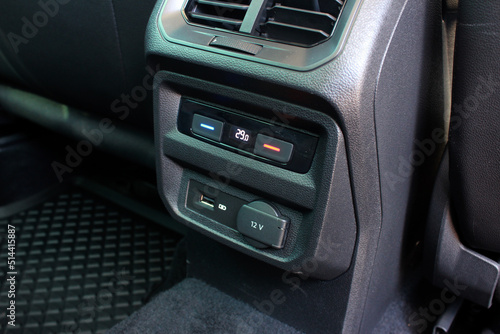 Rear passengers climate control. Modern car USB socket for charging and accessories for passengers, car interior.