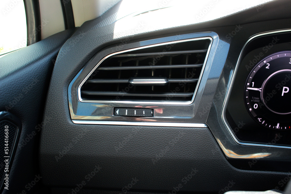 Interior of a modern car. Car conditioning. Vehicle vent interior for cold automobile cool. Auto climate condition. Hot air control panel. Car air conditioner.