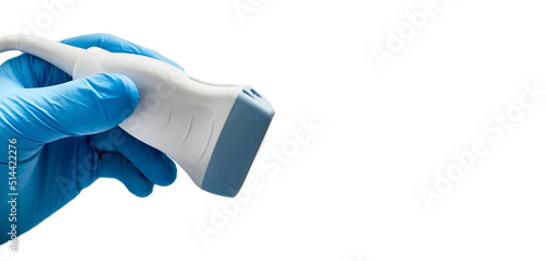 Medical ultrasound probe from ultrasonic machine in doctor's hand close-up, isolated on white. Ultrasound procedures photo