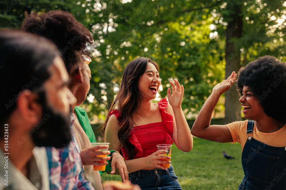 Friends in park laughing Friends in park laughing