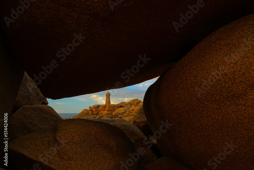 Mean ruz lighthouse in Ploumanac'h in the town of Perros-Guirec in the Côtes-d'Armor department between pink granite rocks