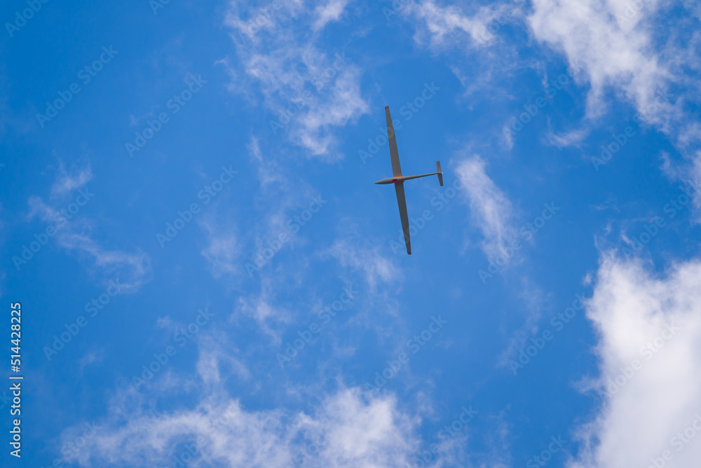 Fototapeta premium Sailplane flying high in blue sky