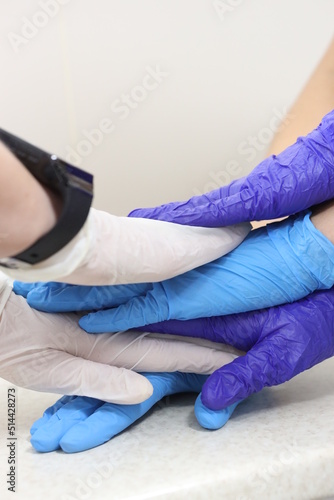 the hands of the medical staff are folded one on top of the other