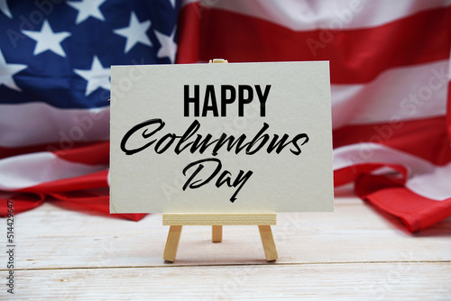 Happy Columbus Day text messege with USA flag on wooden background